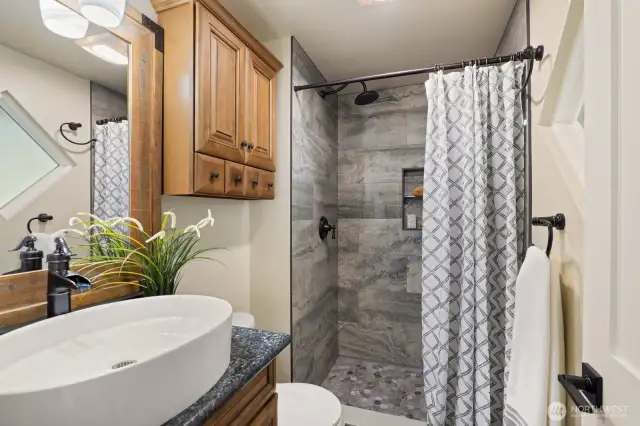 The primary bathroom has been appointed with lovely custom finishes to provide a luxurious experience everyday.