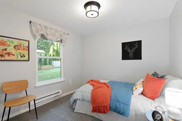 The third bedroom looks quietly out to the backyard and completes the perfect home.