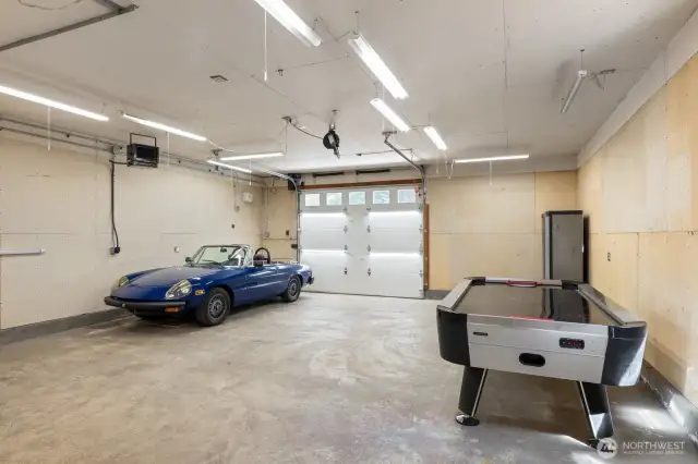 This beauty comfortably accommodates 3 cars, hobbies, or anything else you can imagine!