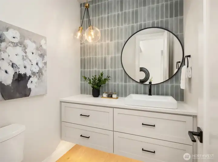 Main floor powder bath with floating vanity and under cabinet motion sensor lighting