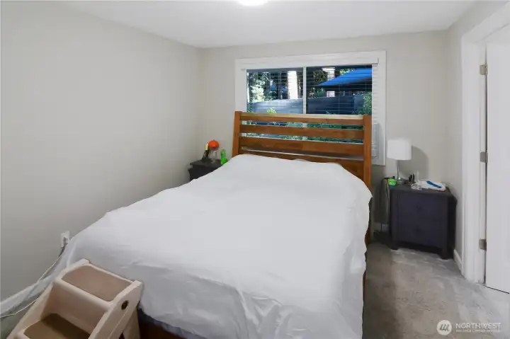 Primary bedroom with large closet, carpeted comfort, and direct access to the full bathroom also connected to the hallway—convenient Bonney Lake rambler layout.