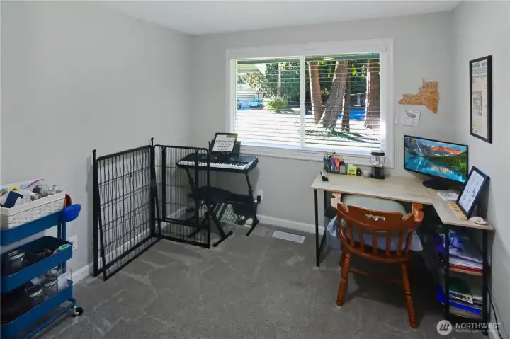 Third bedroom, currently used as an office and music room, with carpet—flexible living space in this Bonney Lake rambler.