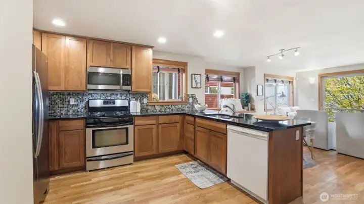 Spacious kitchen with lots of cabinet space + breakfast bar
