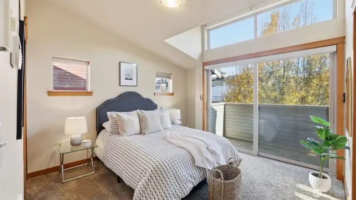 Primary suite with attached 3/4 bath, lovely balcony, and clerestory window