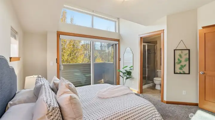 Primary suite with attached 3/4 bath, lovely balcony, and clerestory window
