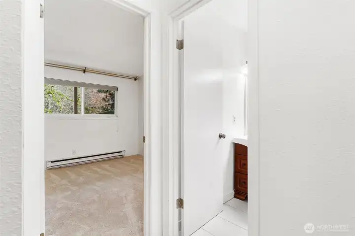 Primary Bedroom and bath from hallway