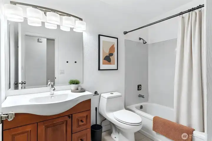 Newly tiled tub surround - Virtually staged