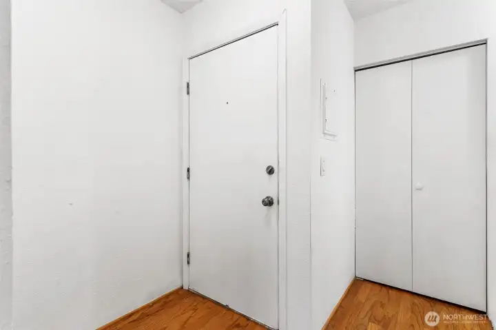 Harwood entry/hallway and 1 of 2 hall closets