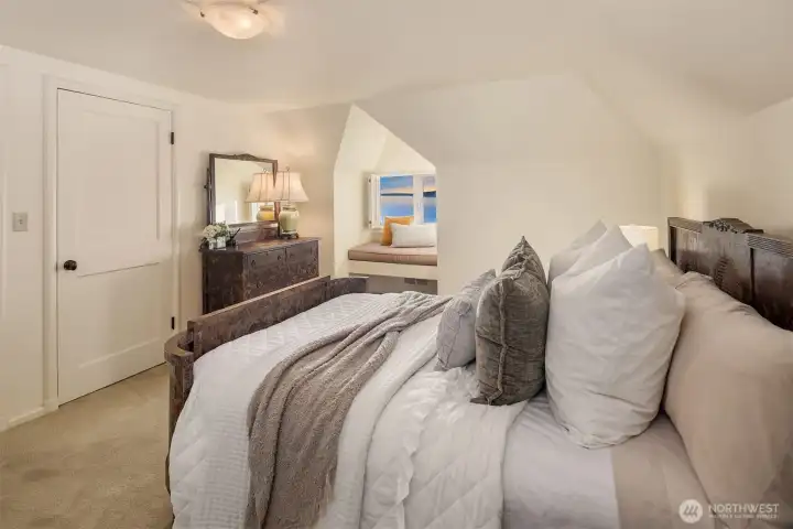 One of three upstairs bedrooms, all featuring a window seat.