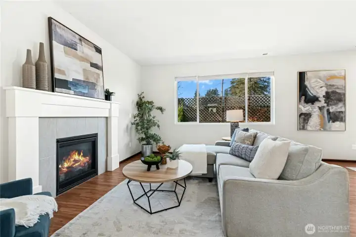 Gas fireplace with tons of natural light from oversized windows