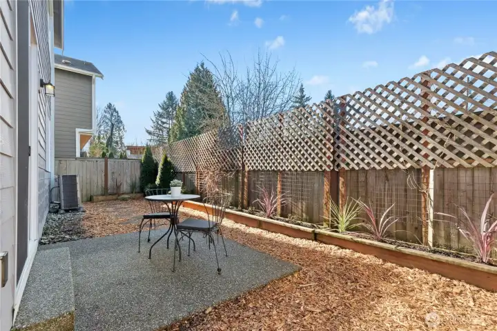 low maintenance backyard with flower beds.