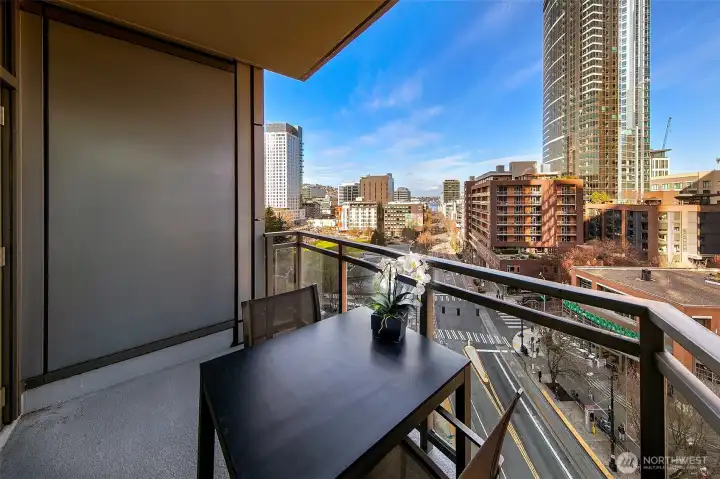 Private covered deck with a great vantage point over the Westlake corridor with the city and Lake Union view on display.