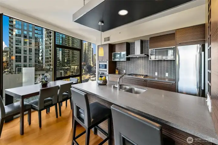 The SE corner curved window walls create functional dining space with a view.