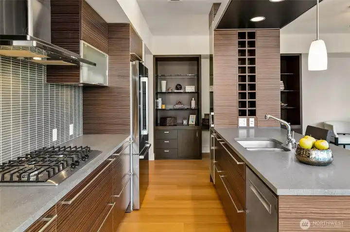 Gas cooktop, basaltina stone slab counters, new refrigerator and dishwasher, tons of storage, convenient built-ins.