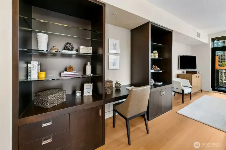 Beautiful built-in offers additional storage, display shelves and comfortable discreet desk.