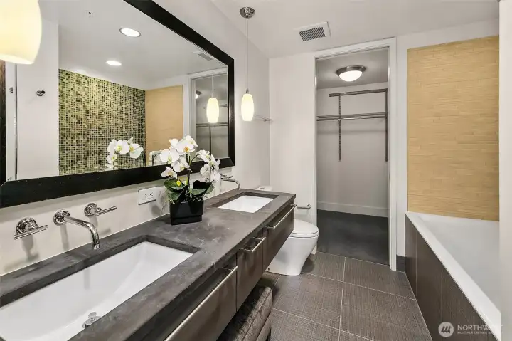 Ensuite 5-piece primary bath has a deep soaking tub, separate shower, dual sink vanity and walk-in closet.