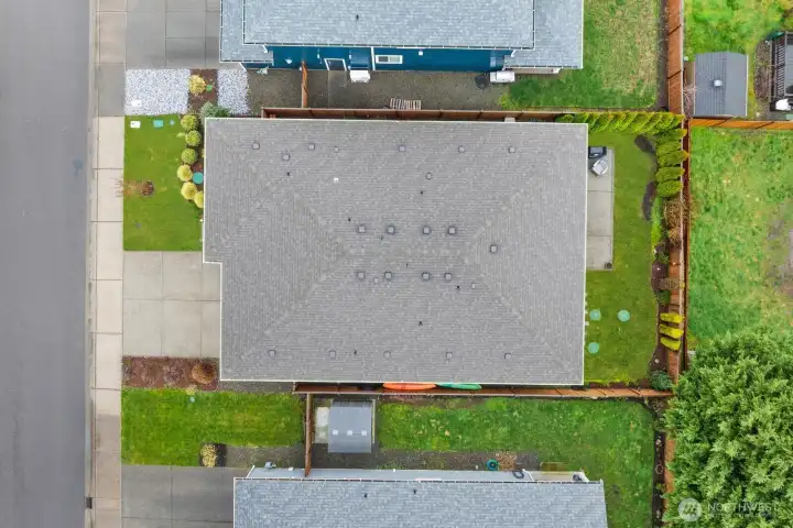 Overhead aerial view showing the full footprint of the home, fenced backyard, patio area, and surrounding landscaping within the Falling Water community in Bonney Lake.