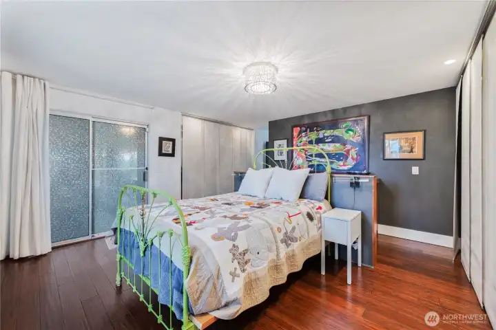 Primary bedroom with slider to back patio