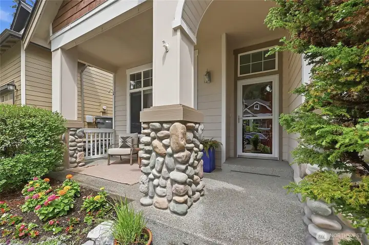 A sophisticated blend of cedar shingle siding, stacked stone accents, and a charming bay window. The manicured lawn and covered entry create a warm and inviting first impression. A sophisticated blend of cedar shingle siding, stacked stone accents, and a charming bay window. The manicured lawn and covered entry create a warm and inviting first impression.