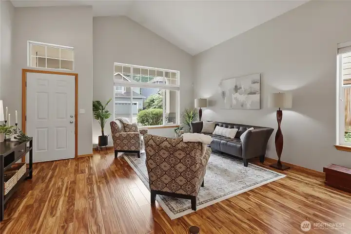 Soaring vaulted ceilings and expansive windows create a grand sense of space in the formal living room. Soaring vaulted ceilings and expansive windows create a grand sense of space in the formal living room.