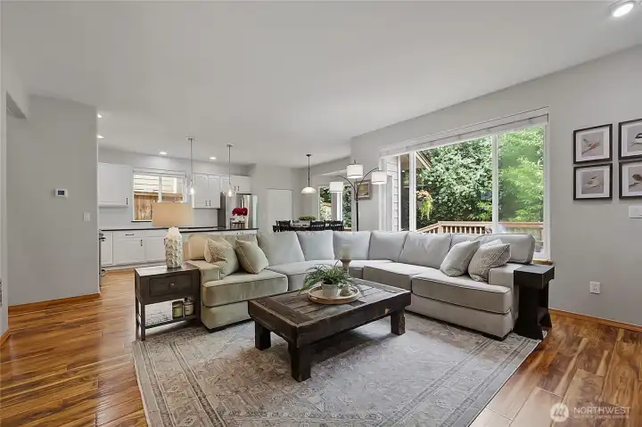 The heart of the home: a sprawling open-concept family room that flows directly into the chef's kitchen. High-end finishes and sightlines to the outdoor deck make this the ultimate hub for daily life. The heart of the home: a sprawling open-concept family room that flows directly into the chef's kitchen. High-end finishes and sightlines to the outdoor deck make this the ultimate hub for daily life.