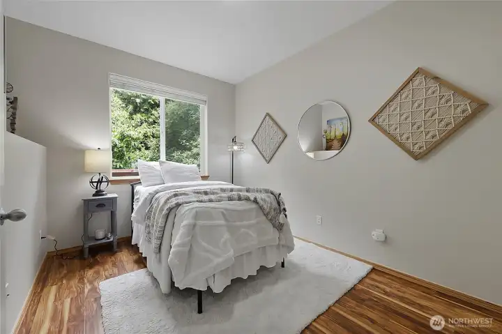 Perfect for multi-generational living or a private home office, spacious main-level bedroom. Its convenient location near the powder room provides an ideal setup for guests or long-term visitors. Perfect for multi-generational living or a private home office, spacious main-level bedroom. Its convenient location near the powder room provides an ideal setup for guests or long-term visitors.