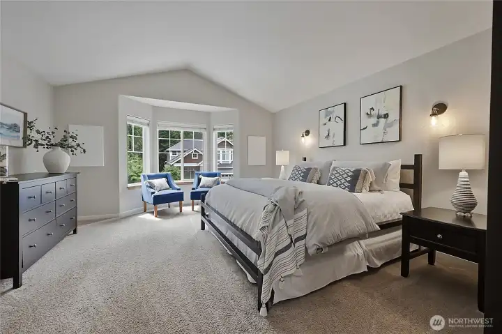 King-sized primary suite featuring large picture windows and a tranquil atmosphere. King-sized primary suite featuring large picture windows and a tranquil atmosphere.
