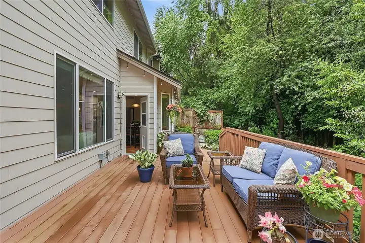 Experience ultimate tranquility in your private backyard sanctuary. The expansive deck and flagstone patio are perfectly positioned to enjoy the peace of the unbuildable greenbelt to the East. Experience ultimate tranquility in your private backyard sanctuary. The expansive deck and flagstone patio are perfectly positioned to enjoy the peace of the unbuildable greenbelt to the East.