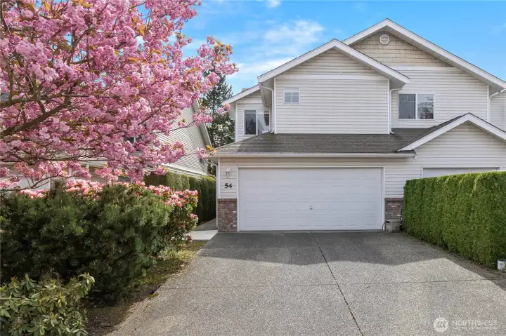 Corner lot with 2 car garage and 2 parking spaces!