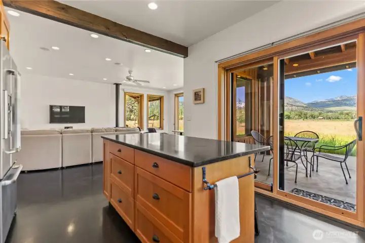 Sliding doors from the kitchen to one of your covered decks makes dining outdoors just a step away.