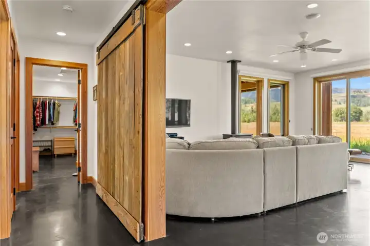 Sliding barn door (to optionally isolate great room from sleeping areas) designed and made by seller.  Reclaimed wood from old vinegar mill in Tonasket.