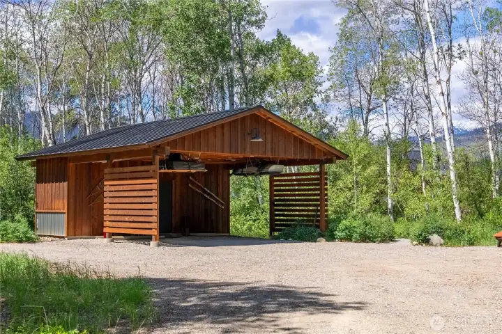 The carport has a 7 by 22 foot interior space for insulated, finished heated shop at the end of the 20 by 24 double carport area.  Carport was constructed with conversion to finished, enclosed garage in mind.  -electric lift for raising and lowering heavy objects onto and off of your car  -manual pully lift in place as well to assist in lifting oversized or heavy objects