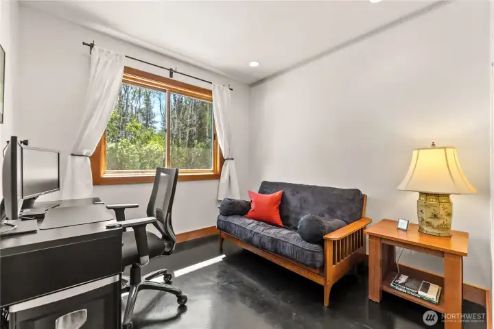 A hard mounted track near the ceiling of the office was intended to support a hanging desk/wall organization system such as the IKEA BOAXEL line.  That vision was never realized, but it is securely mounted if someone wants to continue down this pathway for space saving and a modern aesthetic.
