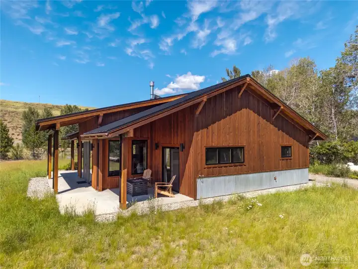 An underground automated sprinkler system was installed by Windy Valley.  They come to turn it on and off seasonally.  Zoned areas for grasses, driplines for trees.  Native grasses used.  Control box located on the back porch.