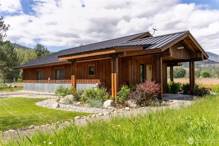Additional highlights include a Kohler auto-start backup generator, insulated finished storage shed, 20x24 carport, heated and insulated shop space, and fiber optic internet.