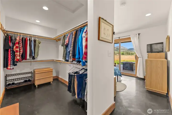 The primary suite includes a generous walk-in closet and an ensuite bath with double sinks and a tiled shower.