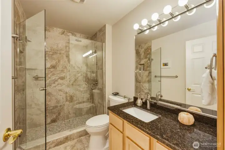 A look into the newly remodeled second bath with beautiful tile work and glass enclosure. A look into the newly remodeled second bath with beautiful tile work and glass enclosure.