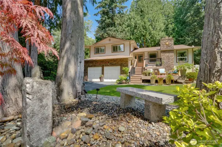 Arrive past towering cedars and a trickling water feature — the setting is the first amenity. Arrive past towering cedars and a trickling water feature — the setting is the first amenity.