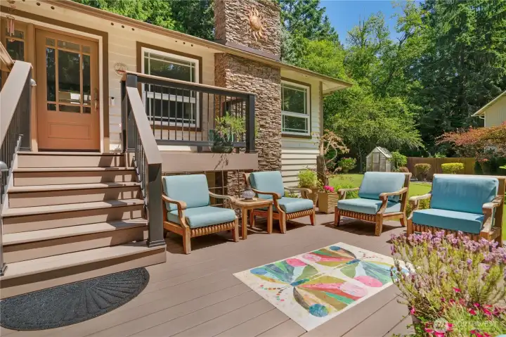 The front deck lives like a porch — morning coffee with the hummingbirds. The front deck lives like a porch — morning coffee with the hummingbirds.