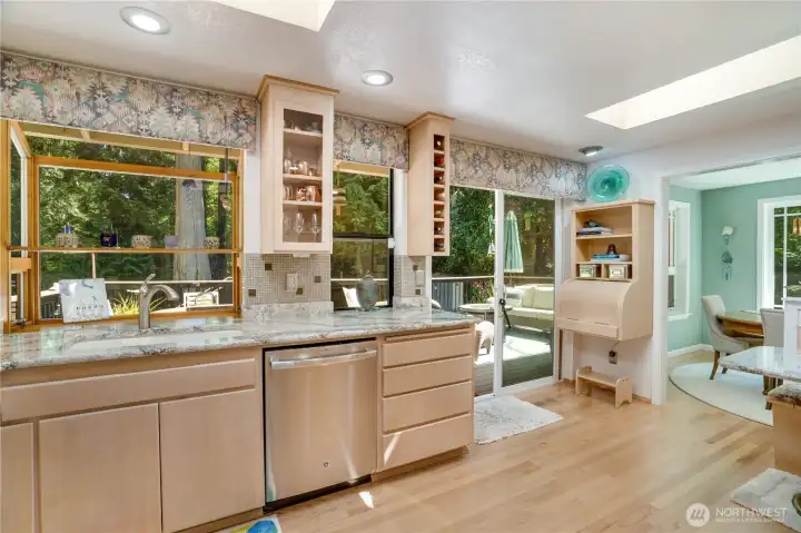 Kitchen flows straight to the entertaining deck through the slider — indoor-outdoor by design. Kitchen flows straight to the entertaining deck through the slider — indoor-outdoor by design.