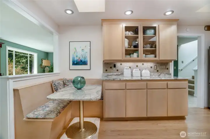Built-in banquette with quartz-top table & built-in storage under cushions. Built-in banquette with quartz-top table & built-in storage under cushions.
