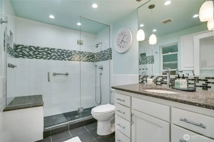 Primary opens to its fully remodeled bath — the suite lives like new construction. Primary opens to its fully remodeled bath — the suite lives like new construction.