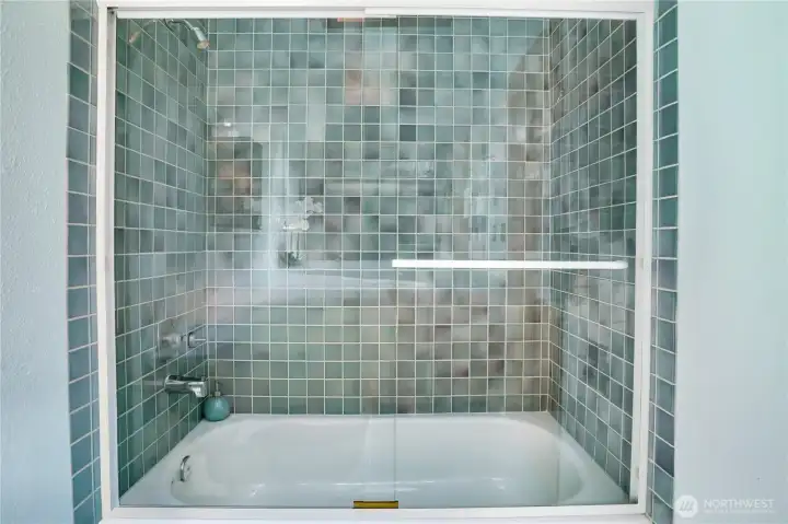 Deep soaking tub with glass surround completes the upper level. Deep soaking tub with glass surround completes the upper level.