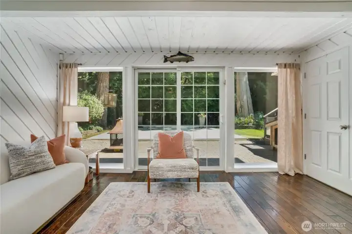 Sliders connect the family room to patio and gardens — seamless flow. Sliders connect the family room to patio and gardens — seamless flow.