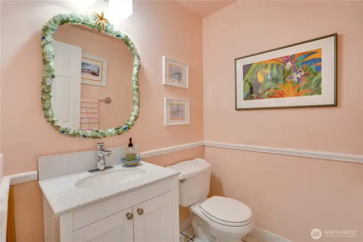 Cheerful lower-level half bath — three baths in all. Cheerful lower-level half bath — three baths in all.