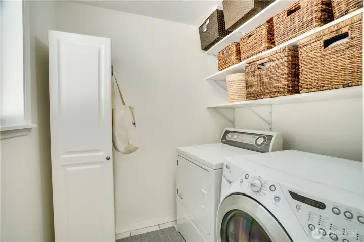 Dedicated laundry room with built-in storage. Dedicated laundry room with built-in storage.