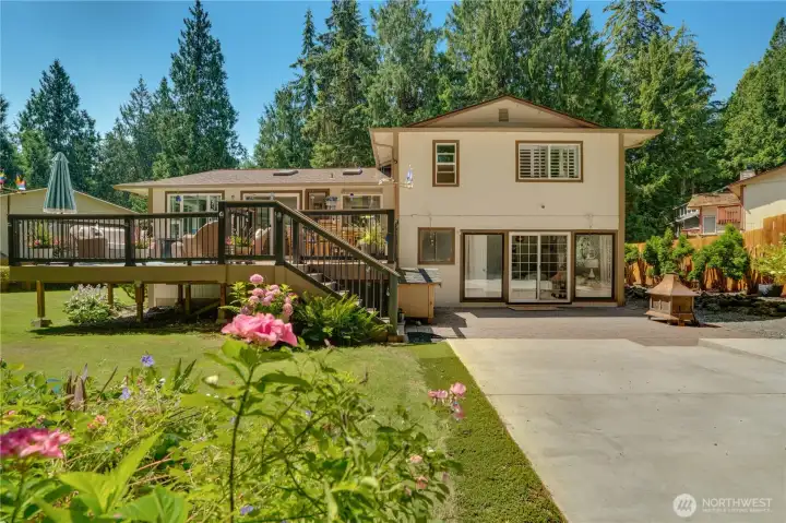 Two sliders connect deck to kitchen and dining — built for summer hosting. Two sliders connect deck to kitchen and dining — built for summer hosting.