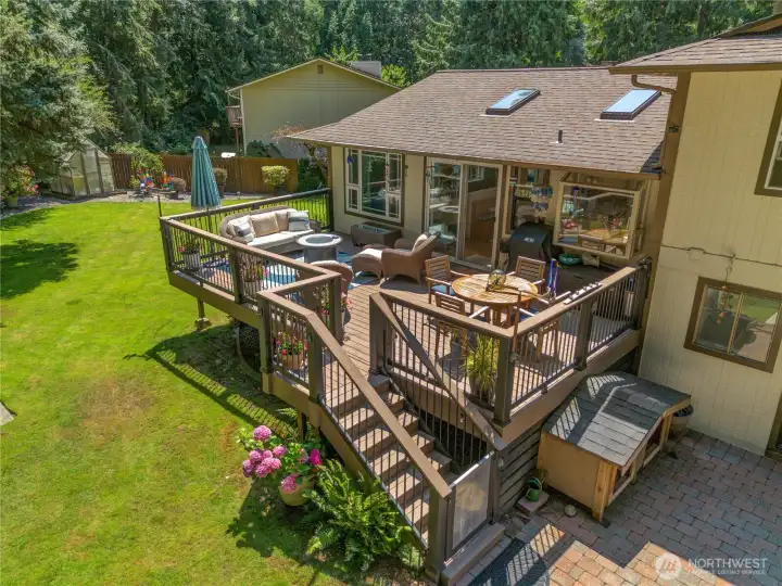 460 sq ft of composite deck living — the whole backyard program in one view. 460 sq ft of composite deck living — the whole backyard program in one view.