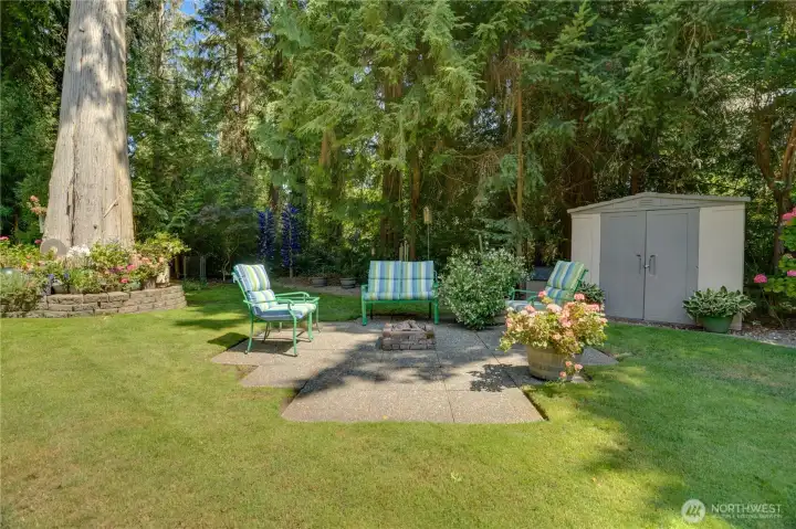 Gather at the built-in gas fire pit, tucked among four decades of curated gardens. Gather at the built-in gas fire pit, tucked among four decades of curated gardens.