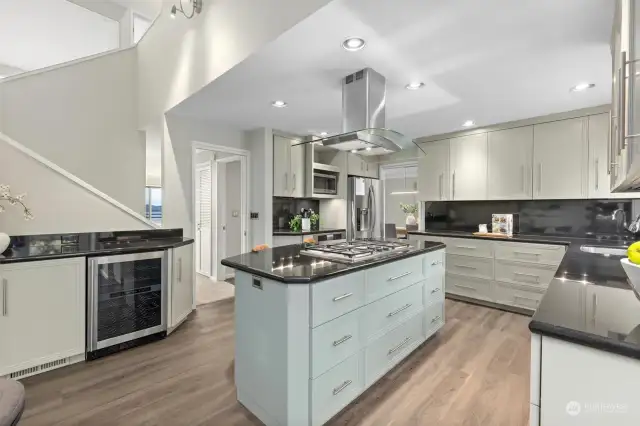 A stunning kitchen featuring polished granite countertops, elegant custom cabinetry, and high-end finishes that exude timeless style and sophistication.